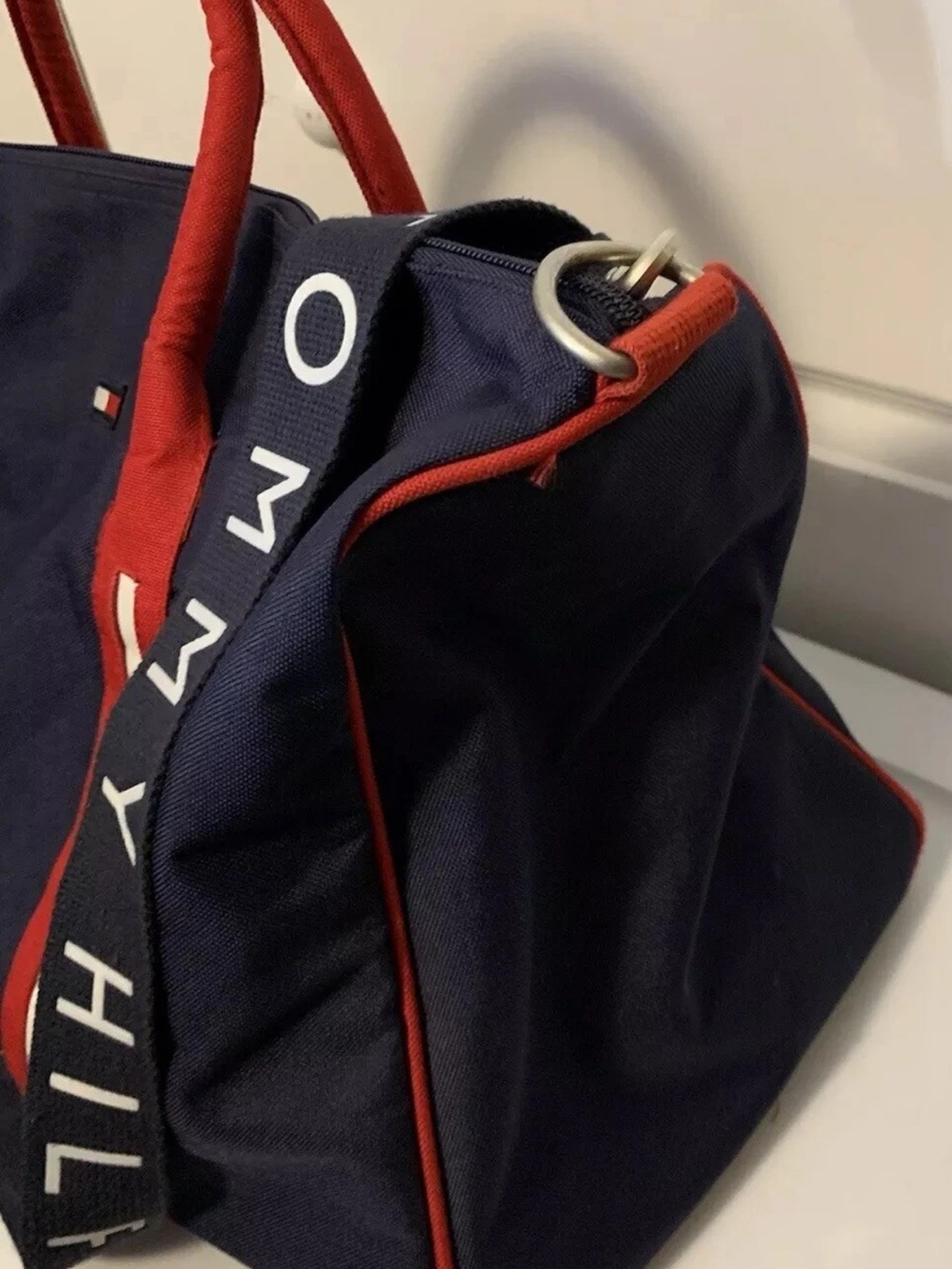 Tommy Hilfiger Navy Duffel with Red Piping and Branded Strap